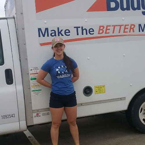 115th Fighter Wing Airman Moore standing in front of a moving truck
